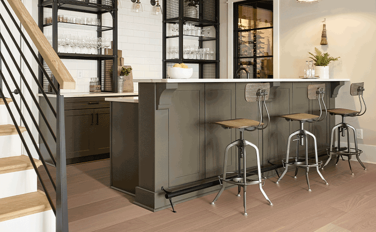 warm toned hardwood flooring in kitchen wet bar
